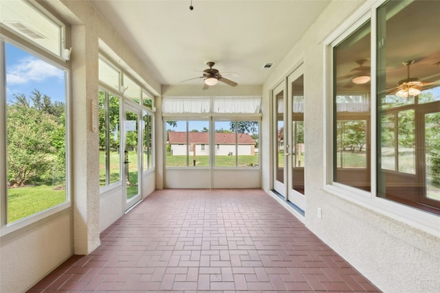 140 Whispering Wind Dr, Georgetown, TX 78633 - unfurnished sunroom with brick floors, french doors, and plenty of natural light