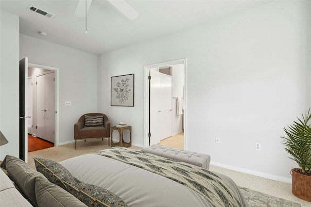 140 Whispering Wind Dr, Georgetown, TX 78633 - carpeted bedroom with ceiling fan and ensuite bath