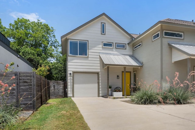6204 Hickman Ave Unit A, Austin, TX 78723 - view of front of home with a garage, a standing seam roof, a metal roof, and concrete driveway