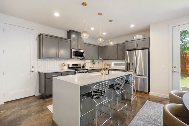 6204 Hickman Ave Unit A, Austin, TX 78723 - kitchen featuring appliances with stainless steel finishes, concrete floors, backsplash, a breakfast bar area, and recessed lighting