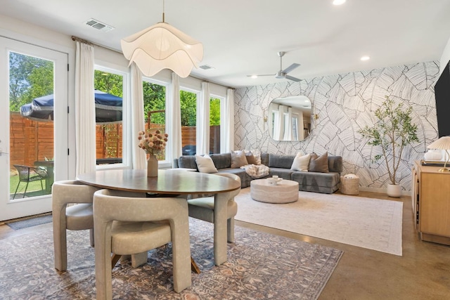 6204 Hickman Ave Unit A, Austin, TX 78723 - dining space with an accent wall, a ceiling fan, recessed lighting, and finished concrete floors