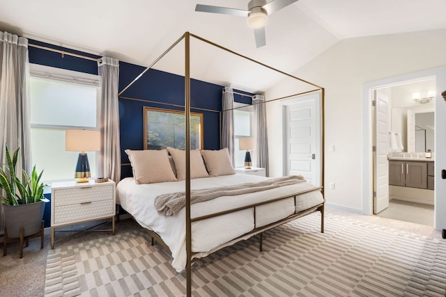 6204 Hickman Ave Unit A, Austin, TX 78723 - carpeted bedroom featuring vaulted ceiling, ensuite bath, and ceiling fan