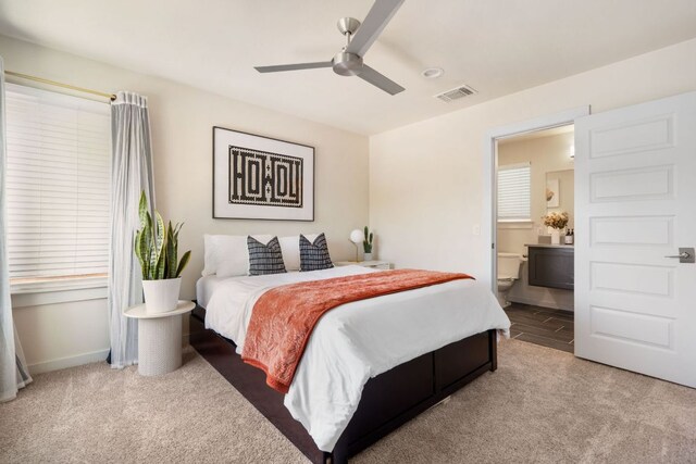 6204 Hickman Ave Unit A, Austin, TX 78723 - carpeted bedroom with ensuite bathroom and a ceiling fan
