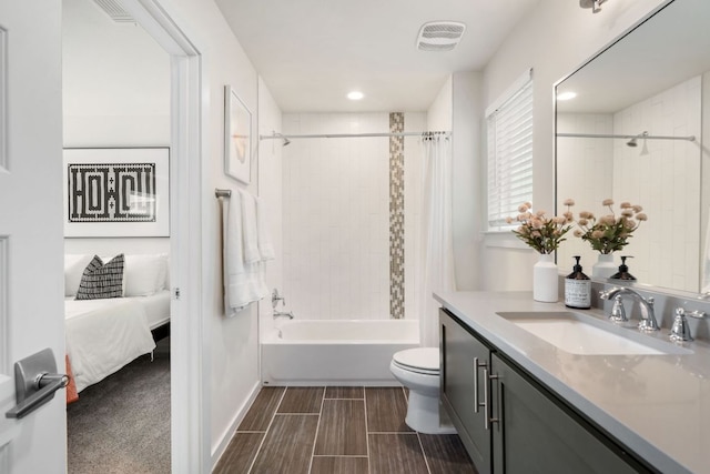 6204 Hickman Ave Unit A, Austin, TX 78723 - bathroom featuring vanity, shower / bath combination with curtain, ensuite bathroom, and recessed lighting
