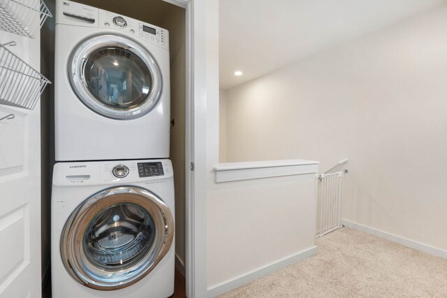 6204 Hickman Ave Unit A, Austin, TX 78723 - laundry room featuring stacked washing machine and dryer, carpet floors, and recessed lighting