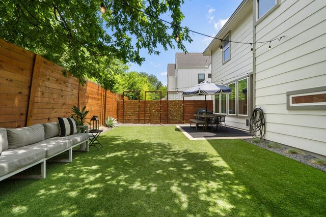 6204 Hickman Ave Unit A, Austin, TX 78723 - fenced backyard featuring outdoor lounge area