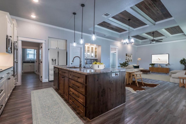 249 Pecan Meadow Ln, Belton, TX 76513 - kitchen with refrigerator with ice dispenser, ornamental molding, dark wood finished floors, white cabinetry, and light stone counters