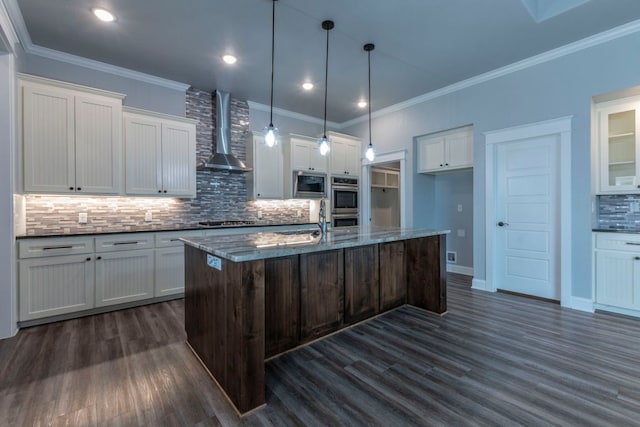 249 Pecan Meadow Ln, Belton, TX 76513 - kitchen with wall chimney range hood, appliances with stainless steel finishes, dark wood-type flooring, decorative backsplash, and white cabinets