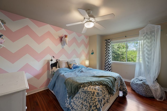 7709 Waldon Dr, Austin, TX 78750 - bedroom featuring wood finished floors, ceiling fan, and wallpapered walls