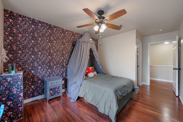 7709 Waldon Dr, Austin, TX 78750 - bedroom with wood finished floors, wallpapered walls, and ceiling fan
