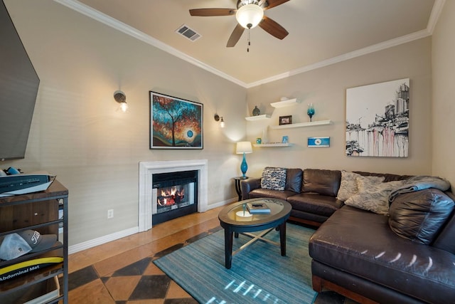 7709 Waldon Dr, Austin, TX 78750 - living area featuring ornamental molding, ceiling fan, and a glass covered fireplace