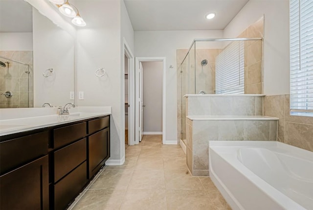 1017 Sundrops St, Leander, TX 78641 - full bathroom featuring a shower stall, a bath, vanity, and tile patterned floors