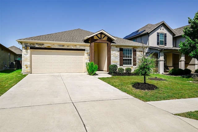 1017 Sundrops St, Leander, TX 78641 - view of front of home featuring stone siding, concrete driveway, a front lawn, and a garage