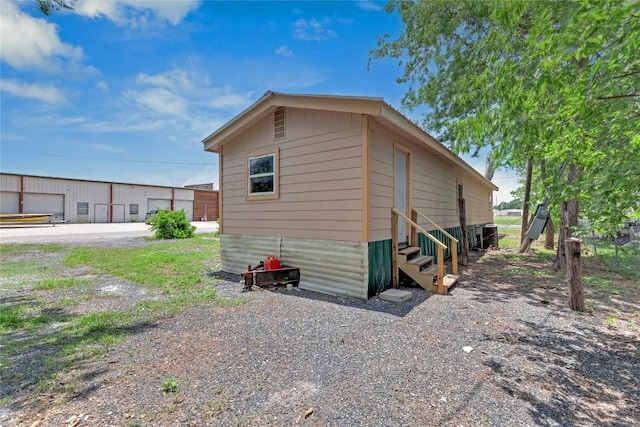 101 E Ash St, Granger, TX 76530 - view of home's exterior featuring entry steps