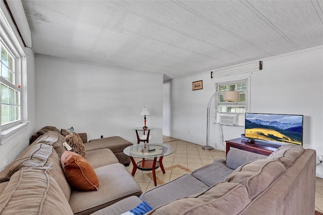 101 E Ash St, Granger, TX 76530 - tiled living area featuring healthy amount of natural light and cooling unit