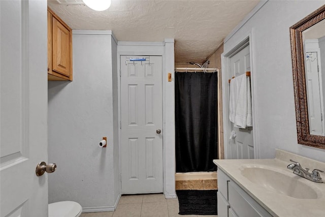 101 E Ash St, Granger, TX 76530 - bathroom with vanity, a shower stall, tile patterned floors, and a textured ceiling