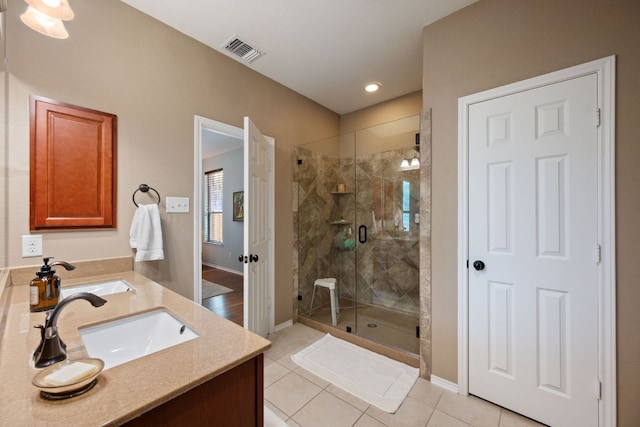 1012 Autumn Sage Way, Pflugerville, TX 78660 - bathroom with a shower stall, vanity, and tile patterned flooring