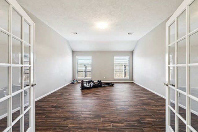2502 Grey Kirby Dr, League City, TX 77573 - exercise area with french doors, wood finished floors, vaulted ceiling, and a textured ceiling