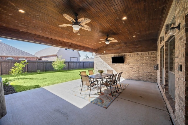 2502 Grey Kirby Dr, League City, TX 77573 - fenced backyard featuring a patio, a ceiling fan, and outdoor dining area