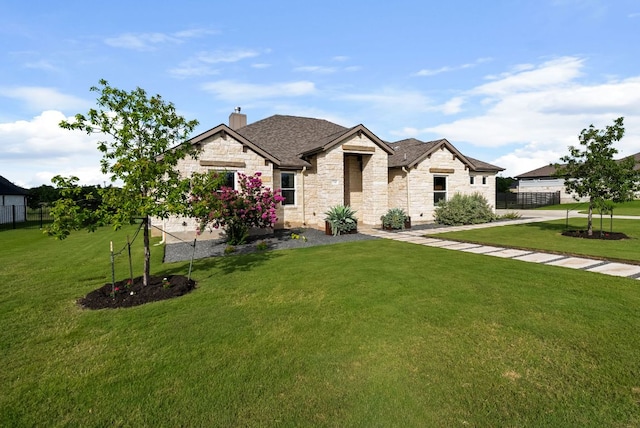 104 Huerta Rd, Florence, TX 76527 - french country style house featuring stone siding, a chimney, and a shingled roof