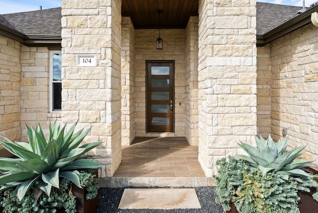 104 Huerta Rd, Florence, TX 76527 - property entrance with a shingled roof and stone siding
