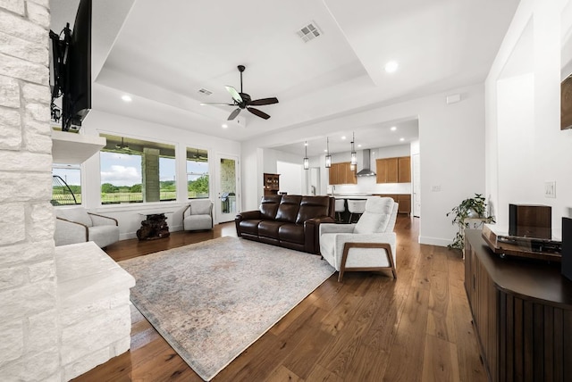 104 Huerta Rd, Florence, TX 76527 - living room featuring ceiling fan, a raised ceiling, dark wood-style floors, and recessed lighting