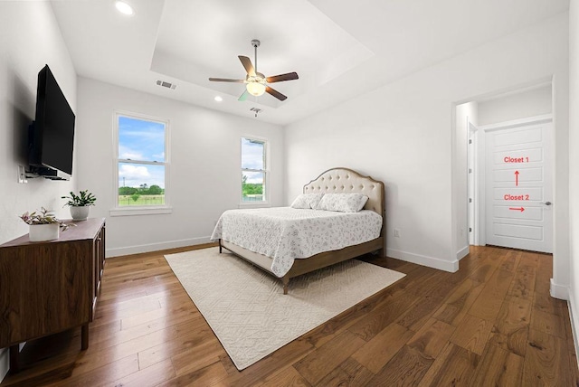 104 Huerta Rd, Florence, TX 76527 - bedroom with a tray ceiling, dark wood-type flooring, recessed lighting, and ceiling fan