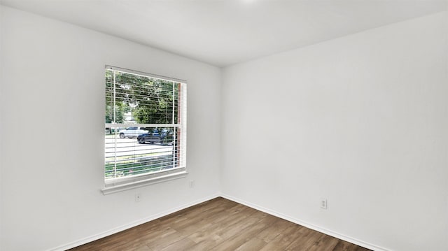 13124 Winecup Mallow Trl, Elgin, TX 78621 - empty room with wood finished floors and baseboards