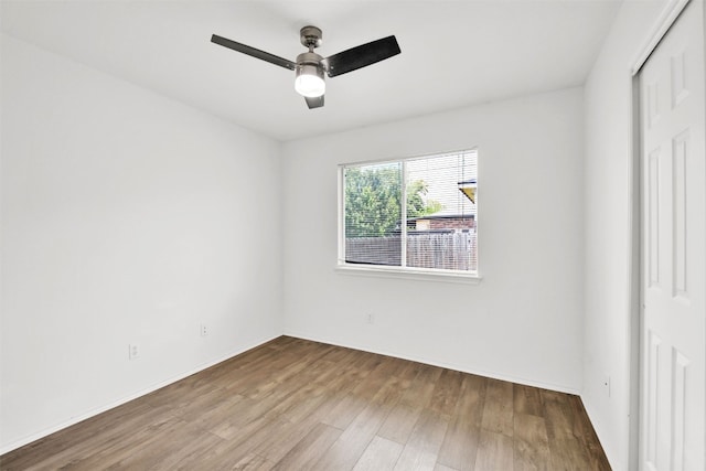 13124 Winecup Mallow Trl, Elgin, TX 78621 - unfurnished bedroom with a closet, wood finished floors, and a ceiling fan