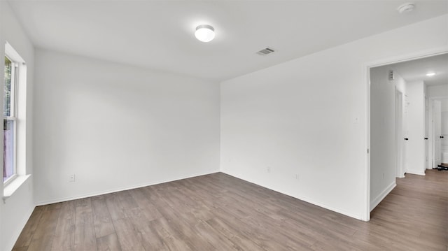 13124 Winecup Mallow Trl, Elgin, TX 78621 - spare room featuring a smoke detector and wood finished floors