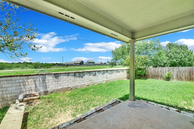 13124 Winecup Mallow Trl, Elgin, TX 78621 - fenced backyard featuring a patio