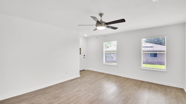 13124 Winecup Mallow Trl, Elgin, TX 78621 - empty room with wood finished floors and ceiling fan