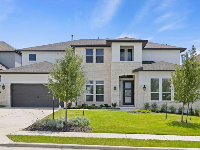 2308 Mondello Path, Leander, TX 78641 - prairie-style home with an attached garage, stone siding, a front lawn, and driveway