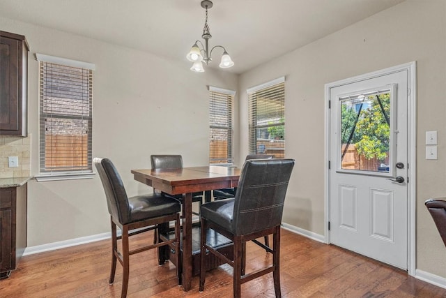 204 Archipelago Trl, Austin, TX 78717 - dining room with light wood-style flooring and a chandelier