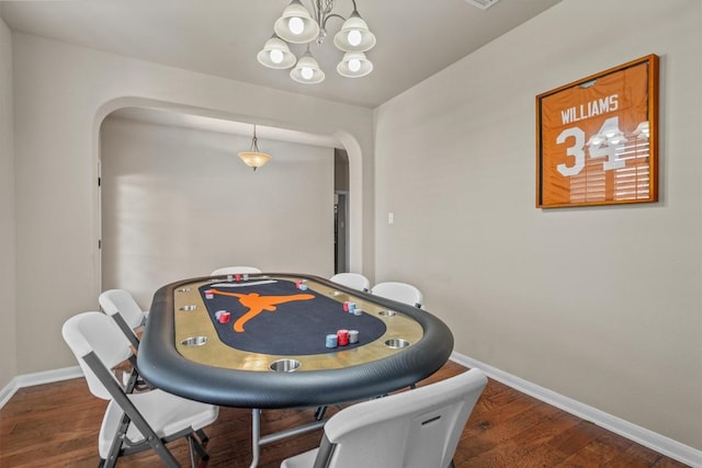 204 Archipelago Trl, Austin, TX 78717 - dining area with arched walkways, wood finished floors, and a chandelier