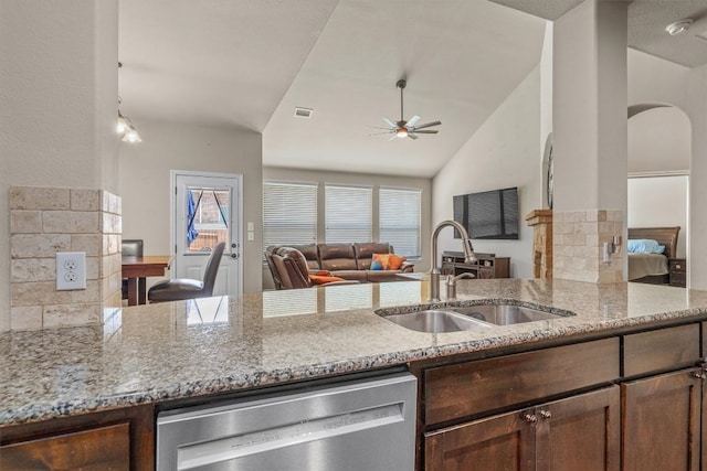 204 Archipelago Trl, Austin, TX 78717 - kitchen featuring stainless steel dishwasher, open floor plan, a ceiling fan, light stone countertops, and vaulted ceiling