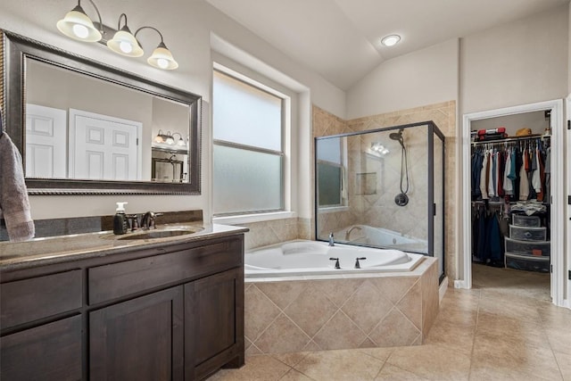 204 Archipelago Trl, Austin, TX 78717 - bathroom with a garden tub, a stall shower, tile patterned flooring, vanity, and a spacious closet