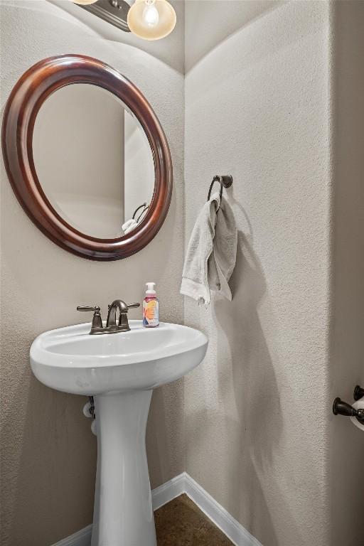 204 Archipelago Trl, Austin, TX 78717 - bathroom with a sink and baseboards