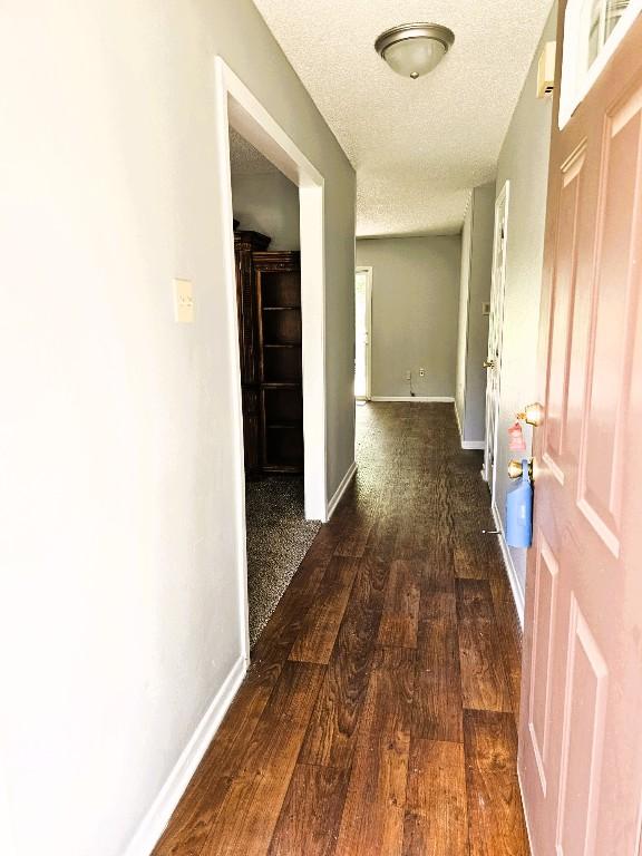 917 Edwards St S, Copperas Cove, TX 76522 - hall featuring a textured ceiling and wood finished floors