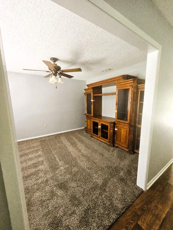 917 Edwards St S, Copperas Cove, TX 76522 - unfurnished living room featuring ceiling fan and a textured ceiling