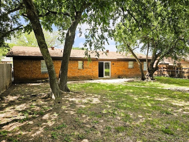 917 Edwards St S, Copperas Cove, TX 76522 - back of house featuring a fenced backyard and brick siding
