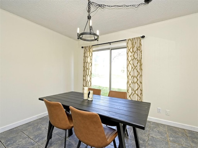 100 Lido Cir Unit A1, Lakeway, TX 78734 - dining space featuring a chandelier and a textured ceiling