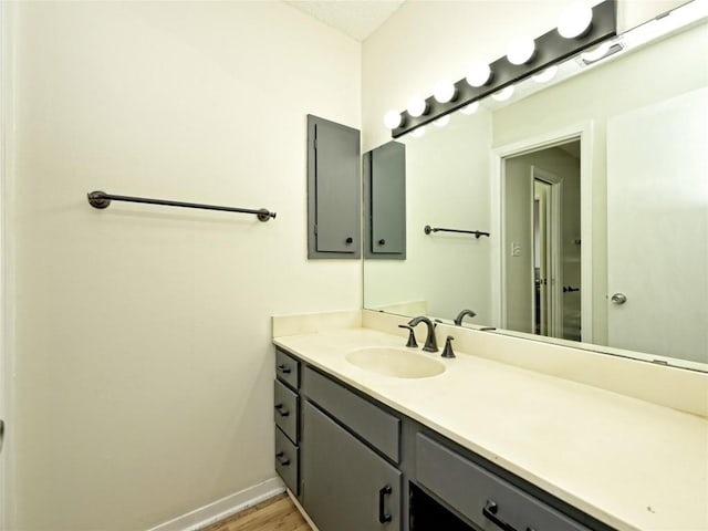 100 Lido Cir Unit A1, Lakeway, TX 78734 - bathroom with vanity and wood finished floors