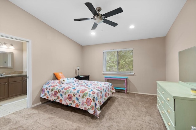 1021 Solano Dr Unit 1054A, Austin, TX 78750 - bedroom with light colored carpet, ensuite bathroom, recessed lighting, and ceiling fan