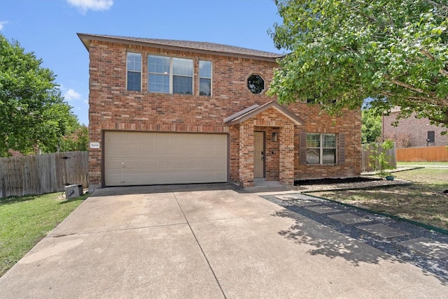 509 Red Tailed Hawk Dr, Pflugerville, TX 78660 - traditional-style house featuring a garage, concrete driveway, and brick siding