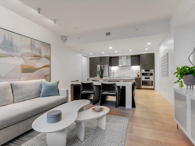 301 W Ave Unit 1207, Austin, TX 78701 - living area featuring light wood finished floors and recessed lighting