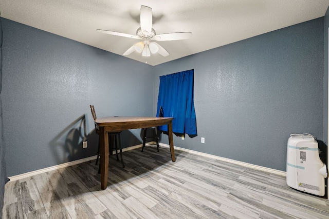 3010 Adam Cv, Round Rock, TX 78681 - office area featuring wood finished floors, a textured wall, and a ceiling fan