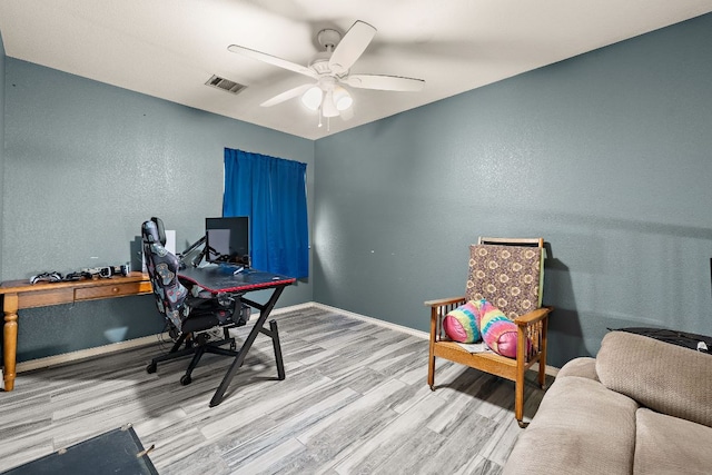 3010 Adam Cv, Round Rock, TX 78681 - office area featuring wood finished floors, a ceiling fan, and a textured wall