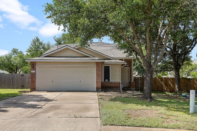 3010 Adam Cv, Round Rock, TX 78681 - single story home with driveway, brick siding, an attached garage, and roof with shingles