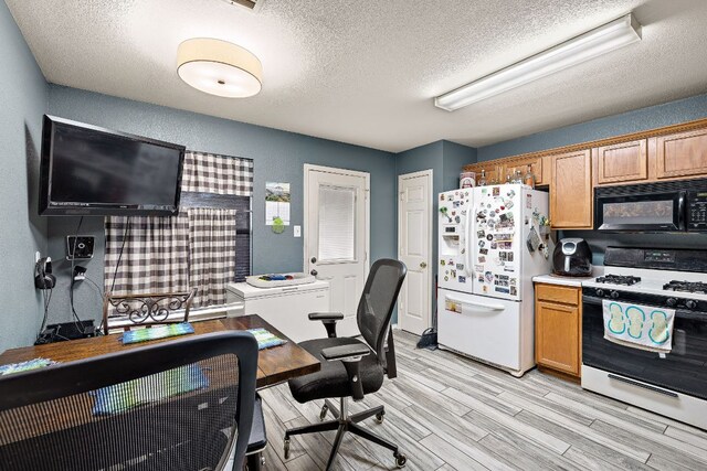 3010 Adam Cv, Round Rock, TX 78681 - office with a textured ceiling and light wood-type flooring